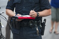 Officer writing traffic ticket in Osceola County